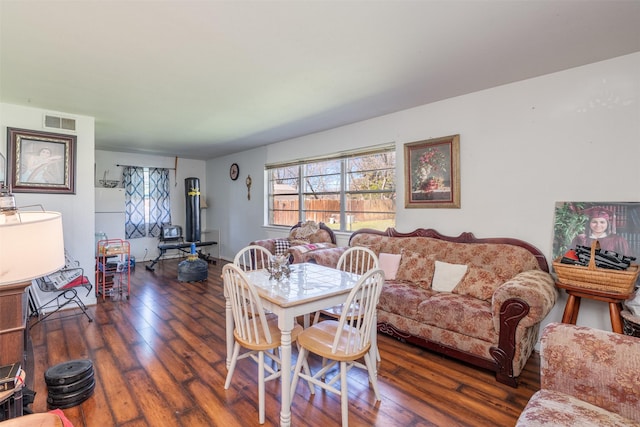 dining area featuring visible vents and wood finished floors