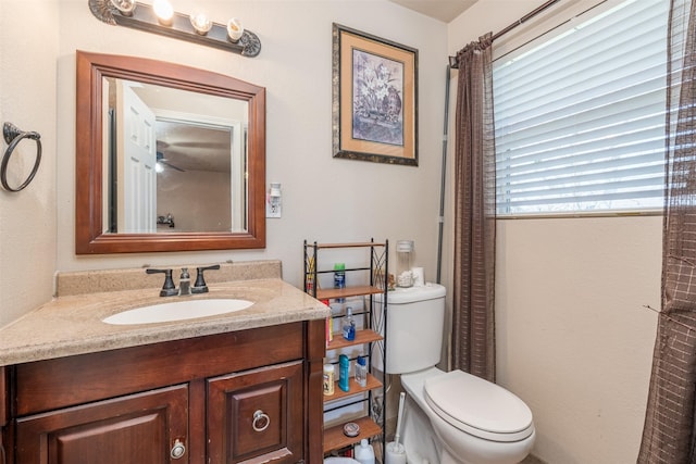 bathroom with toilet and vanity