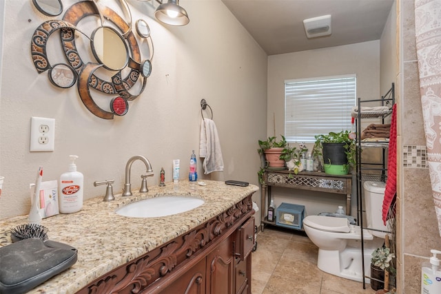 full bathroom featuring toilet and vanity