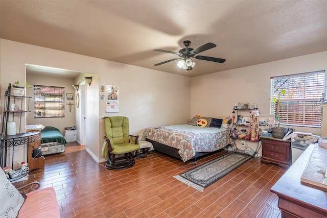 8308 Doreen Ave, Fort Worth, TX 76116 - bedroom featuring wood finished floors, a textured ceiling, and a ceiling fan