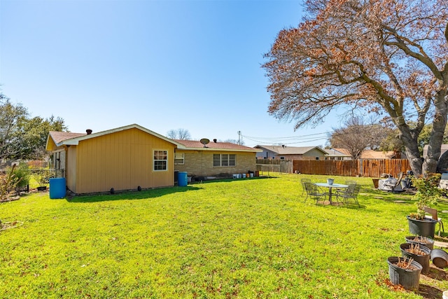 view of yard with a fenced backyard