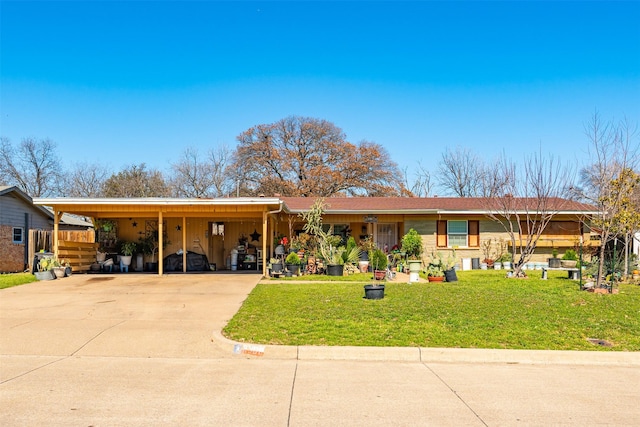 single story home featuring a carport, concrete driveway, and a front lawn