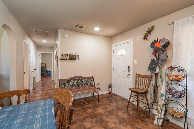 foyer featuring visible vents and baseboards