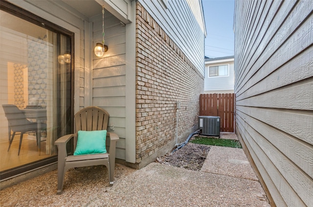 view of patio with fence and central AC