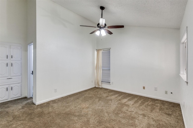 carpeted empty room with high vaulted ceiling, baseboards, a textured ceiling, and a ceiling fan