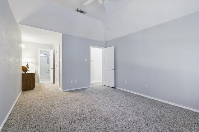 unfurnished bedroom featuring vaulted ceiling, baseboards, visible vents, and carpet floors