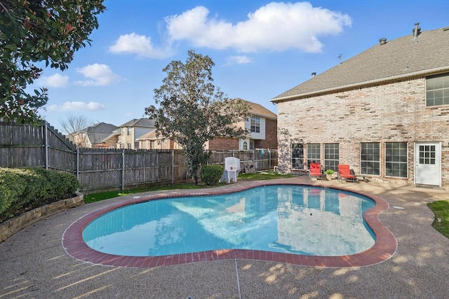 view of swimming pool featuring a fenced in pool, a patio, and a fenced backyard