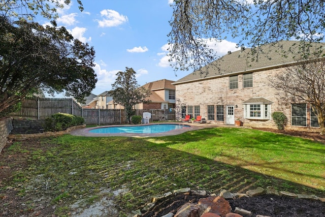 view of yard featuring a fenced in pool, a patio, and a fenced backyard