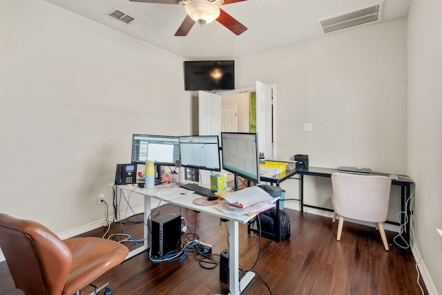 office area featuring visible vents, wood-type flooring, baseboards, and ceiling fan