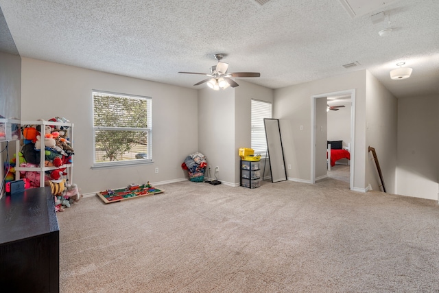 rec room with attic access, carpet flooring, baseboards, and visible vents