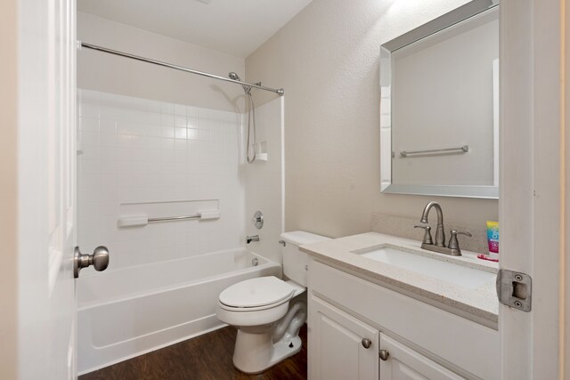 full bath featuring toilet, vanity, bathtub / shower combination, and wood finished floors