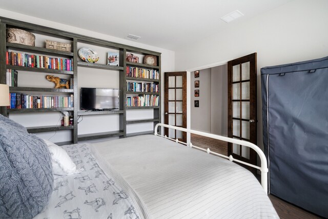 bedroom featuring visible vents