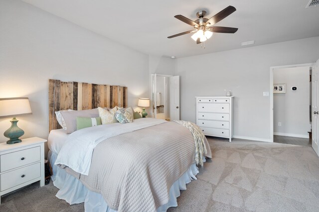 carpeted bedroom featuring visible vents, ceiling fan, and baseboards