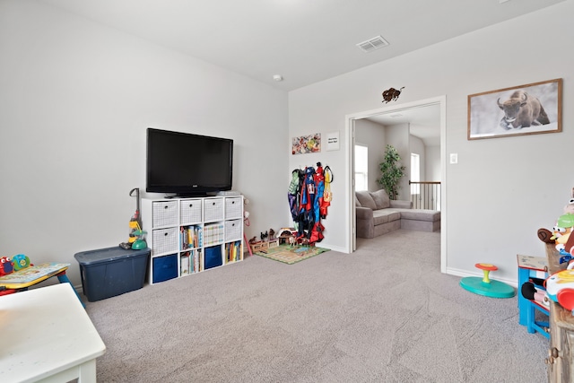 playroom featuring visible vents, baseboards, and carpet floors