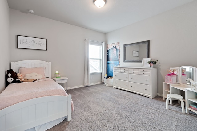 bedroom with carpet flooring and baseboards