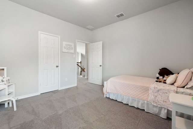 bedroom featuring visible vents, baseboards, and carpet flooring