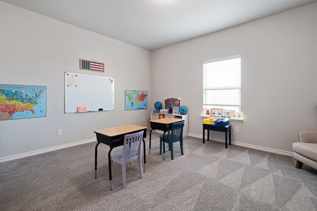 recreation room with carpet flooring and baseboards