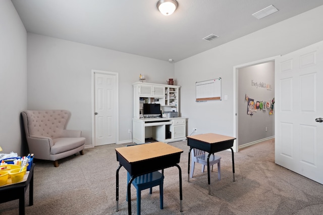 carpeted office with visible vents and baseboards