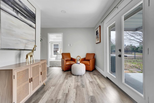 sitting room featuring wood finished floors