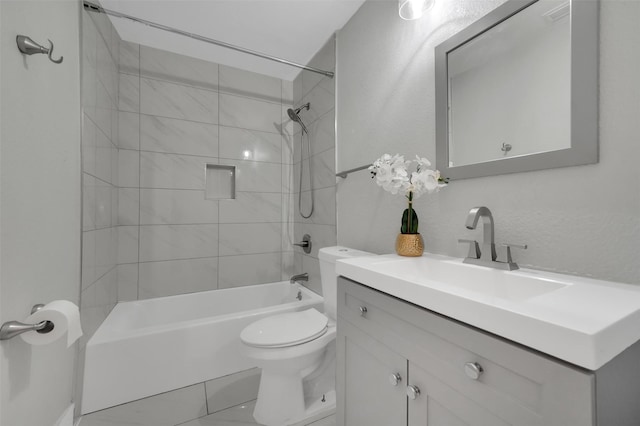 bathroom featuring toilet, shower / bathtub combination, and vanity