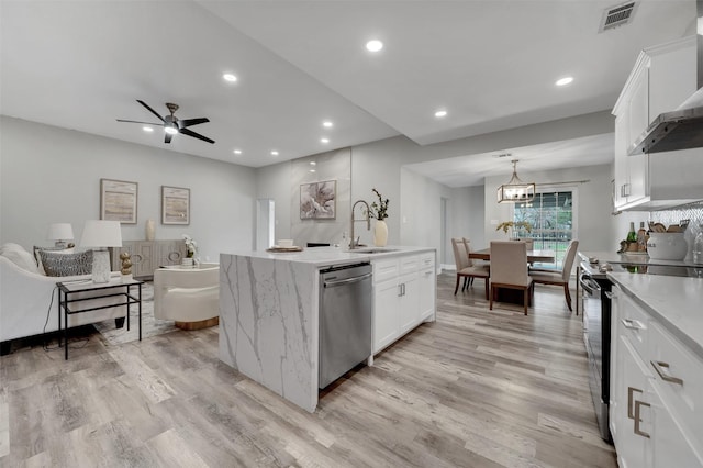 kitchen featuring wall chimney exhaust hood, light wood finished floors, stainless steel dishwasher, electric range, and visible vents
