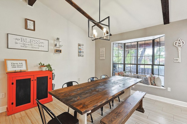 dining room featuring baseboards, light wood finished floors, vaulted ceiling with beams, and an inviting chandelier