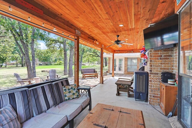 view of patio with an outdoor living space, french doors, and a ceiling fan