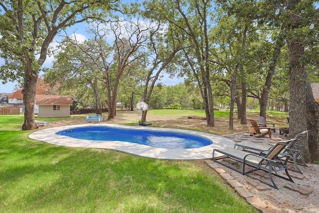 view of pool featuring a yard