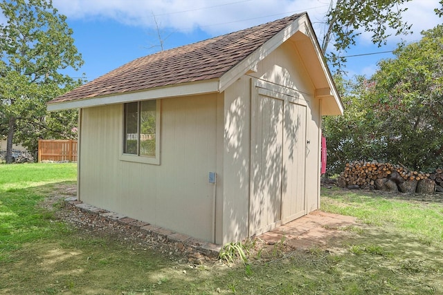 view of shed with fence