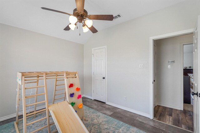 bedroom with visible vents, baseboards, lofted ceiling, and a ceiling fan