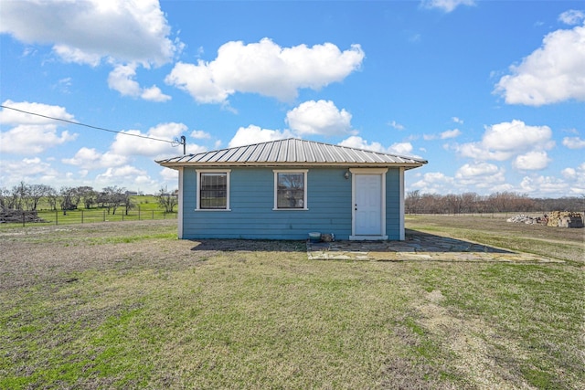 view of outbuilding featuring an outbuilding and fence