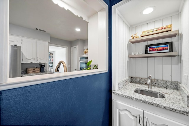 1605 Tampico Dr, Plano, TX 75075 - bar area featuring appliances with stainless steel finishes and recessed lighting