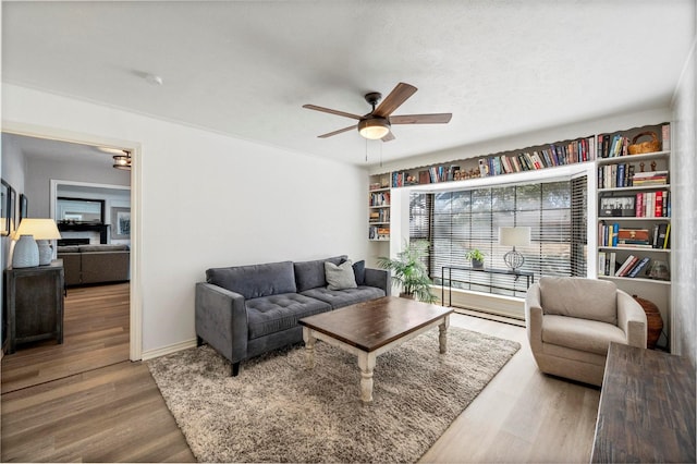 1605 Tampico Dr, Plano, TX 75075 - living area with a ceiling fan and wood finished floors
