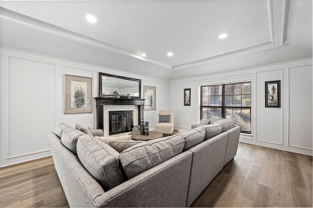 1605 Tampico Dr, Plano, TX 75075 - living room with a decorative wall, wood finished floors, recessed lighting, a tray ceiling, and a fireplace