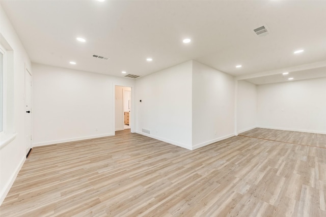 spare room featuring recessed lighting, visible vents, and light wood-style flooring