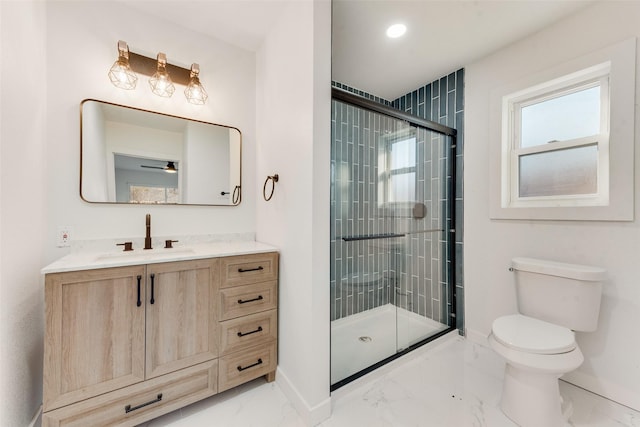 bathroom featuring marble finish floor, a stall shower, toilet, and baseboards