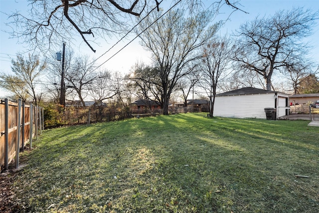 view of yard featuring an outbuilding and a fenced backyard