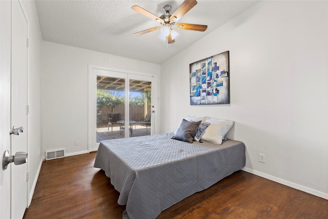 bedroom with wood finished floors, baseboards, visible vents, access to exterior, and a textured ceiling