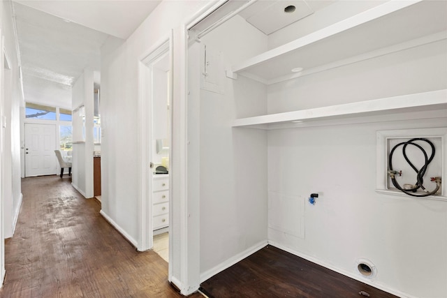 clothes washing area featuring laundry area, hookup for a washing machine, dark wood-type flooring, and baseboards