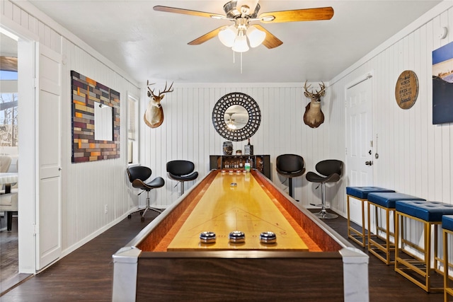 playroom featuring a ceiling fan, wood finished floors, and baseboards