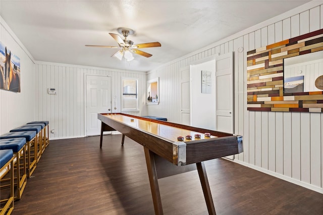 playroom with baseboards, a ceiling fan, and wood finished floors