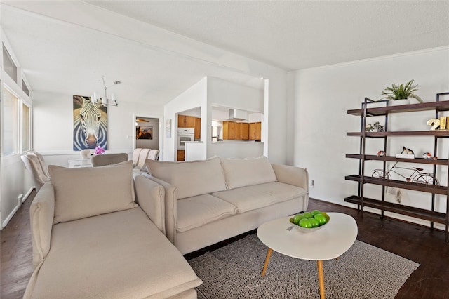 living room with a notable chandelier and wood finished floors