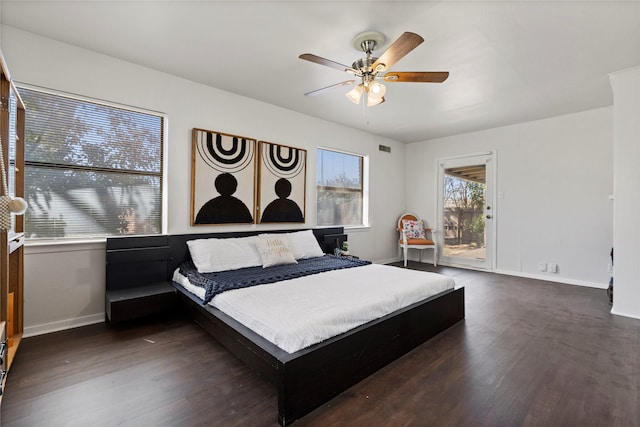 bedroom with visible vents, a ceiling fan, dark wood-type flooring, and baseboards