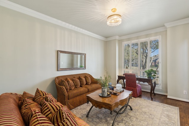 living area with baseboards, wood finished floors, and crown molding