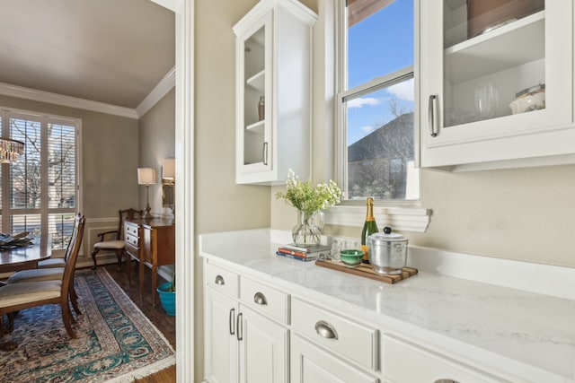 interior space with dark wood-type flooring and crown molding