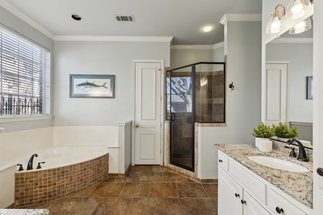 bathroom with vanity, a garden tub, visible vents, a stall shower, and crown molding