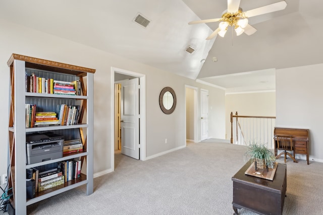 living area featuring visible vents, lofted ceiling, an upstairs landing, and carpet flooring