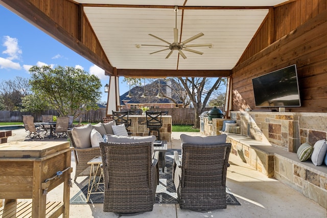 view of patio featuring area for grilling, a ceiling fan, outdoor dining area, and a fenced backyard