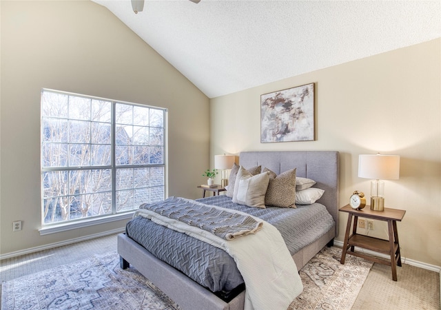 bedroom featuring vaulted ceiling, multiple windows, light colored carpet, and baseboards