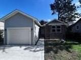 garage featuring driveway